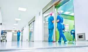 Three medical staff standing in a Hospital hallway